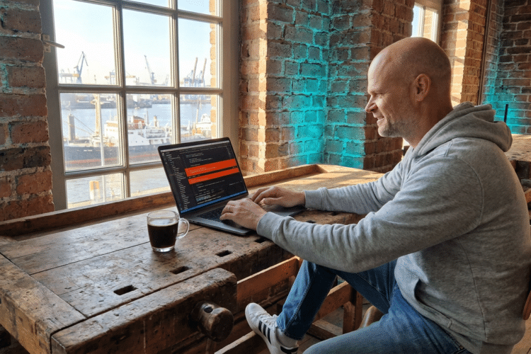 Entwickler debuggt Error-Handling-Code an Laptop mit rot markierten Fehlerhinweisen in moderner Werkstatt-Umgebung